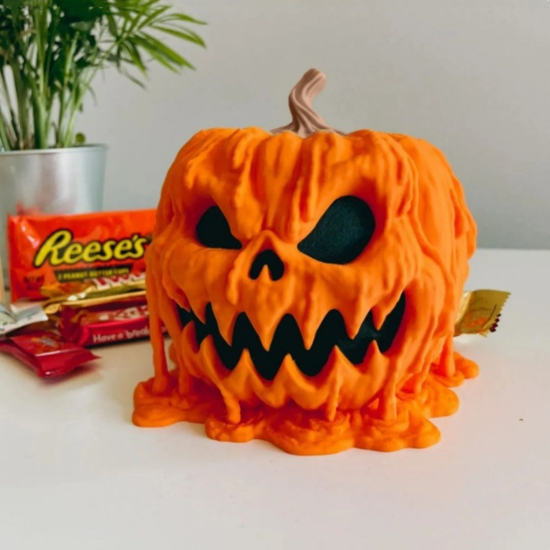 Bol à bonbons citrouille d'Halloween en fusion